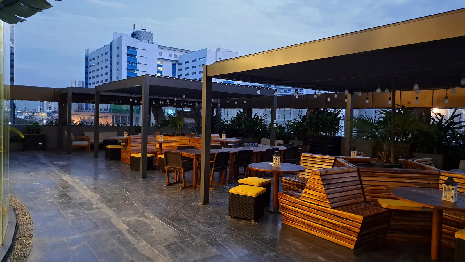 Covered outdoor terrace with wood decking and bench seating